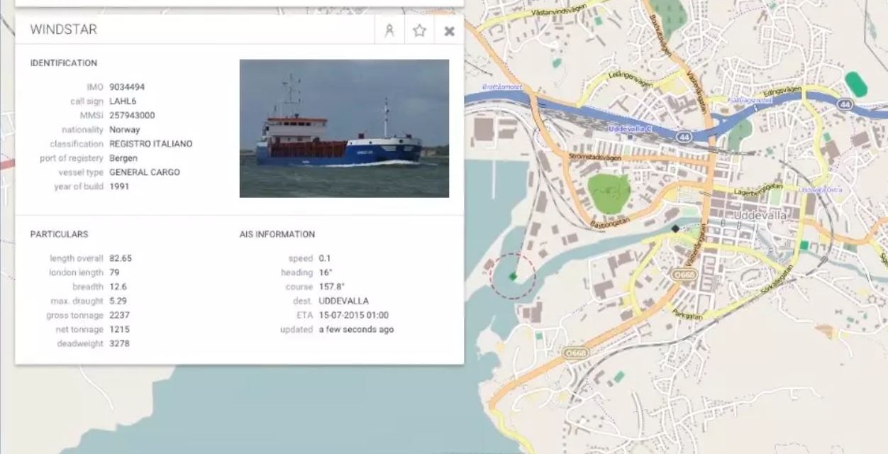 The BTS Coasting vessel database open over the live AIS map, showing a general cargo vessel's particulars and AIS information